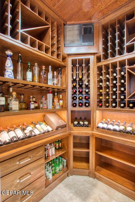 6572 Tuscany Ridge Dr, El Paso, TX 79912 - wine room with wooden ceiling