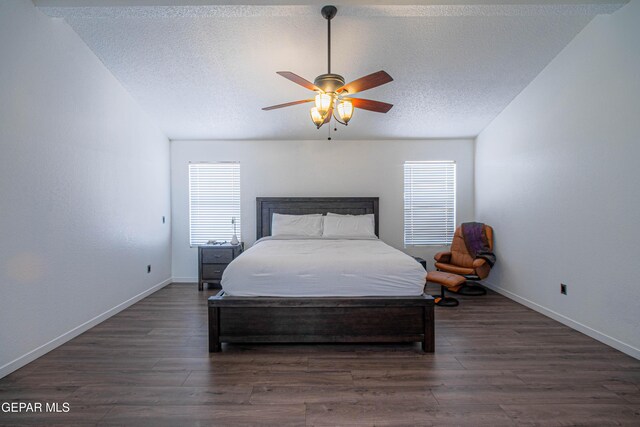 7573 Le Conte Dr Unit A, El Paso, TX 79912 - bedroom with a textured ceiling, wood finished floors, baseboards, and a ceiling fan