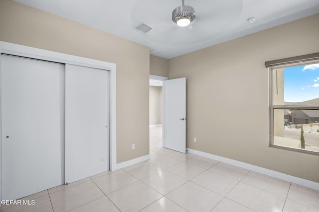 6071 Desert Whisper Ct, El Paso, TX 79912 - unfurnished bedroom with a closet, light tile patterned flooring, and baseboards