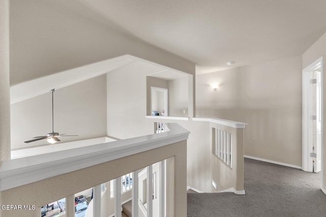 7101 Mesquite Tree Ln, El Paso, TX 79934 - hallway with dark carpet, an upstairs landing, and baseboards