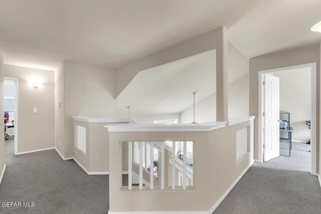 7101 Mesquite Tree Ln, El Paso, TX 79934 - hallway featuring carpet flooring, baseboards, vaulted ceiling, and an upstairs landing
