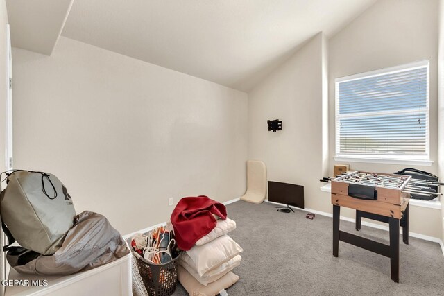 7101 Mesquite Tree Ln, El Paso, TX 79934 - recreation room featuring carpet floors, vaulted ceiling, and baseboards