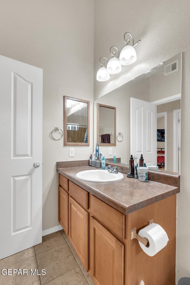 7101 Mesquite Tree Ln, El Paso, TX 79934 - bathroom with vanity and tile patterned floors