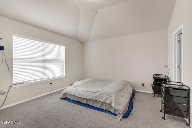 7101 Mesquite Tree Ln, El Paso, TX 79934 - carpeted bedroom featuring lofted ceiling and baseboards