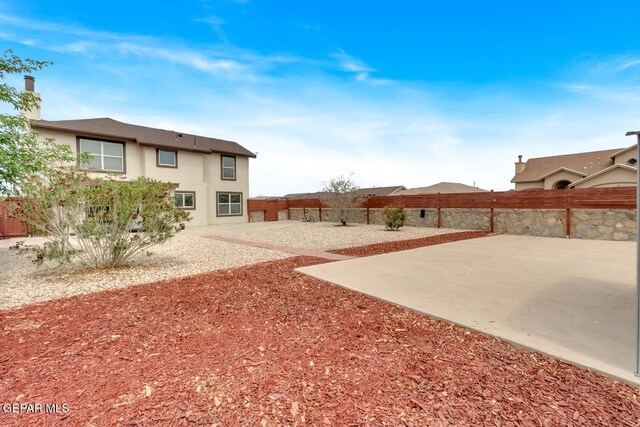 7101 Mesquite Tree Ln, El Paso, TX 79934 - fenced backyard with a patio area