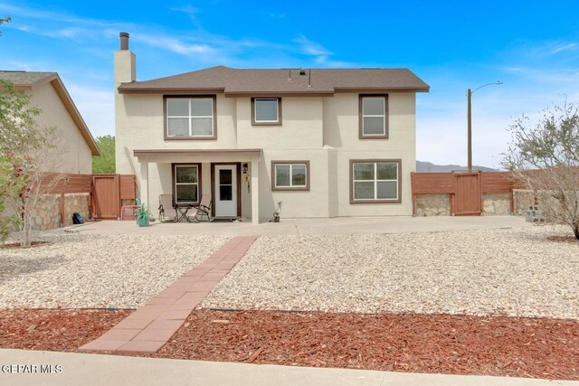 7101 Mesquite Tree Ln, El Paso, TX 79934 - rear view of property featuring a gate, a patio, a chimney, and a fenced backyard