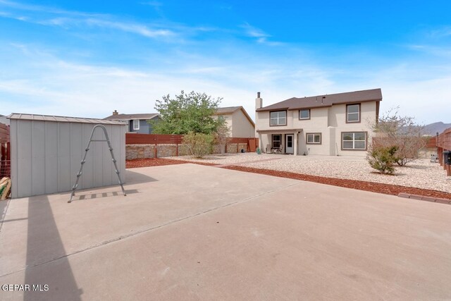 7101 Mesquite Tree Ln, El Paso, TX 79934 - back of property featuring a patio, a fenced backyard, and stucco siding