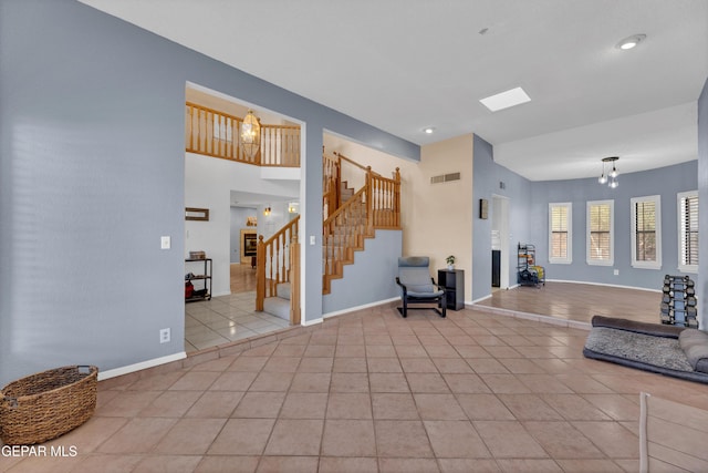 6101 Via Suerte Ave, El Paso, TX 79912 - entryway with light tile patterned flooring, stairway, and baseboards