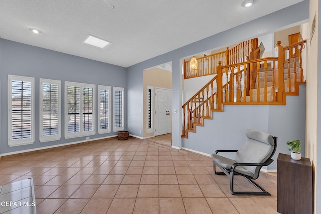 6101 Via Suerte Ave, El Paso, TX 79912 - entrance foyer featuring stairway, tile patterned floors, baseboards, and recessed lighting
