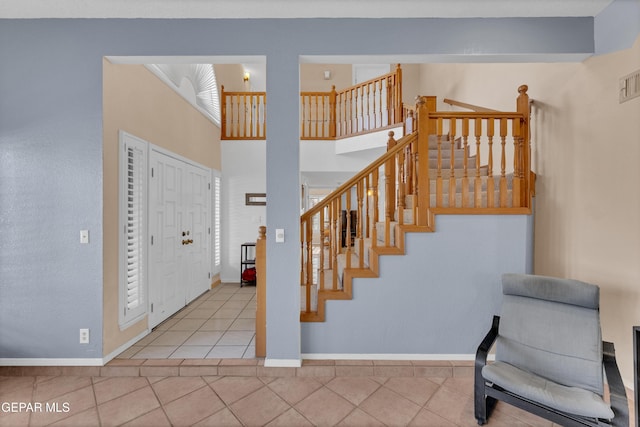 6101 Via Suerte Ave, El Paso, TX 79912 - stairs with tile patterned flooring and baseboards