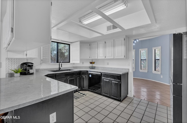 6101 Via Suerte Ave, El Paso, TX 79912 - kitchen featuring black dishwasher, a sink, plenty of natural light, and light tile patterned flooring