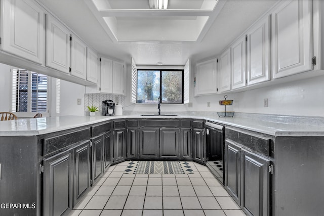 6101 Via Suerte Ave, El Paso, TX 79912 - kitchen featuring a sink, white cabinets, dishwasher, and light tile patterned floors