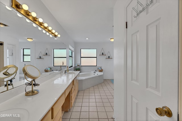 6101 Via Suerte Ave, El Paso, TX 79912 - bathroom with double vanity, a garden tub, tile patterned flooring, and recessed lighting