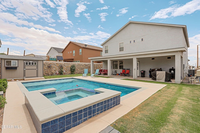 12749 Iron Falls Dr, Horizon City, TX 79928 - view of swimming pool featuring a patio area, a pool with connected hot tub, an outdoor structure, and outdoor lounge area