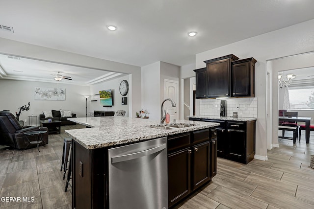 12749 Iron Falls Dr, Horizon City, TX 79928 - kitchen with dishwasher, a sink, open floor plan, light stone countertops, and recessed lighting