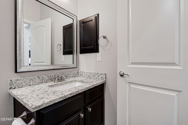 12749 Iron Falls Dr, Horizon City, TX 79928 - bathroom featuring vanity and a textured wall
