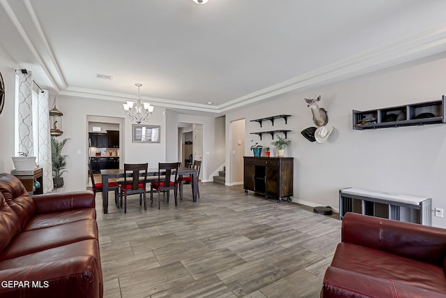 12749 Iron Falls Dr, Horizon City, TX 79928 - living area with a chandelier, a tray ceiling, baseboards, and wood finished floors