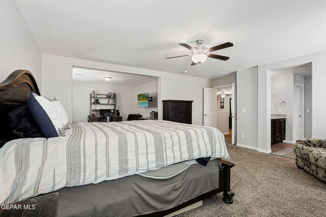 12749 Iron Falls Dr, Horizon City, TX 79928 - bedroom featuring carpet, a ceiling fan, baseboards, and connected bathroom