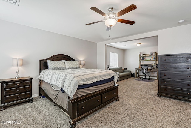 12749 Iron Falls Dr, Horizon City, TX 79928 - carpeted bedroom with an office area and a ceiling fan