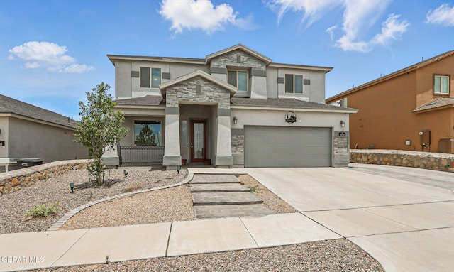 12749 Iron Falls Dr, Horizon City, TX 79928 - view of front of house with stucco siding, concrete driveway, an attached garage, and stone siding