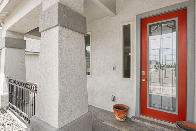 12749 Iron Falls Dr, Horizon City, TX 79928 - doorway to property with stucco siding