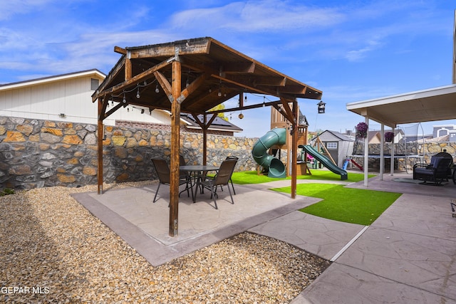 11973 Regal Banner Ln, El Paso, TX 79936 - view of patio with a playground
