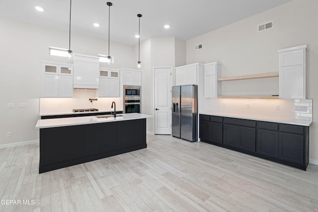 13351 Jeff Winton Dr, El Paso, TX 79928 - kitchen with appliances with stainless steel finishes, a sink, light countertops, tasteful backsplash, and open shelves