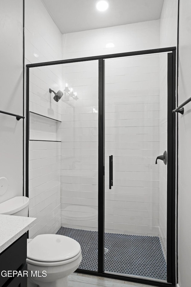 13351 Jeff Winton Dr, El Paso, TX 79928 - full bathroom featuring vanity, toilet, and a stall shower
