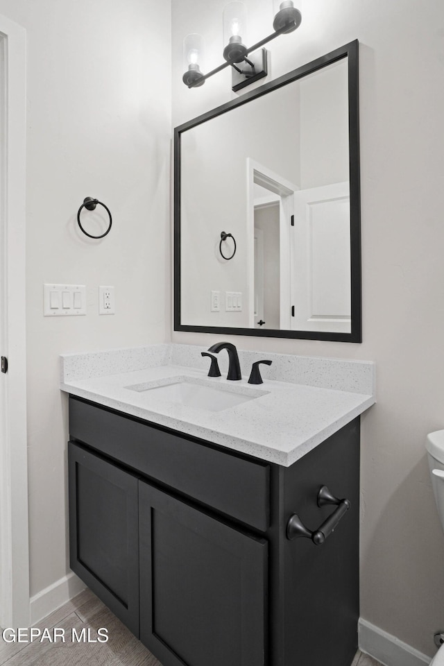 13351 Jeff Winton Dr, El Paso, TX 79928 - half bath with vanity, baseboards, and toilet