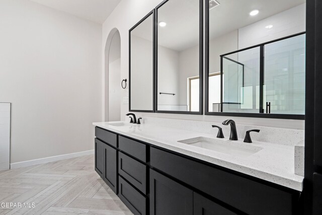 13351 Jeff Winton Dr, El Paso, TX 79928 - full bath featuring double vanity, a stall shower, baseboards, and recessed lighting