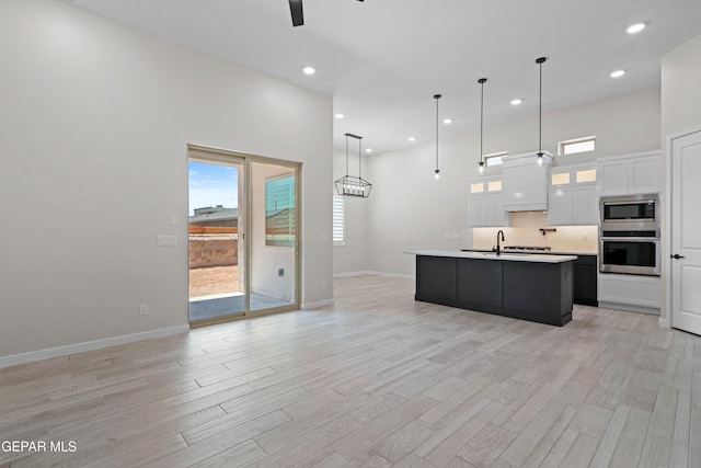 13351 Jeff Winton Dr, El Paso, TX 79928 - kitchen featuring appliances with stainless steel finishes, a ceiling fan, white cabinets, plenty of natural light, and recessed lighting
