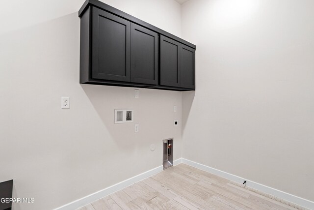 13351 Jeff Winton Dr, El Paso, TX 79928 - washroom featuring hookup for an electric dryer, hookup for a gas dryer, light wood-type flooring, cabinet space, and hookup for a washing machine