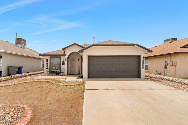 11840 Balladeer Ave, El Paso, TX 79936 - single story home with an attached garage, concrete driveway, stucco siding, and central air condition unit