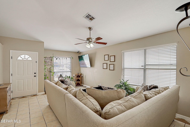11840 Balladeer Ave, El Paso, TX 79936 - living area with ceiling fan, light tile patterned floors, and baseboards