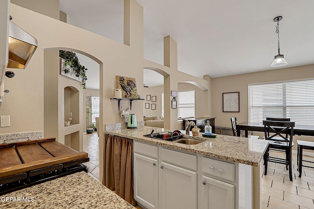 11840 Balladeer Ave, El Paso, TX 79936 - kitchen with light tile patterned flooring, plenty of natural light, and a sink
