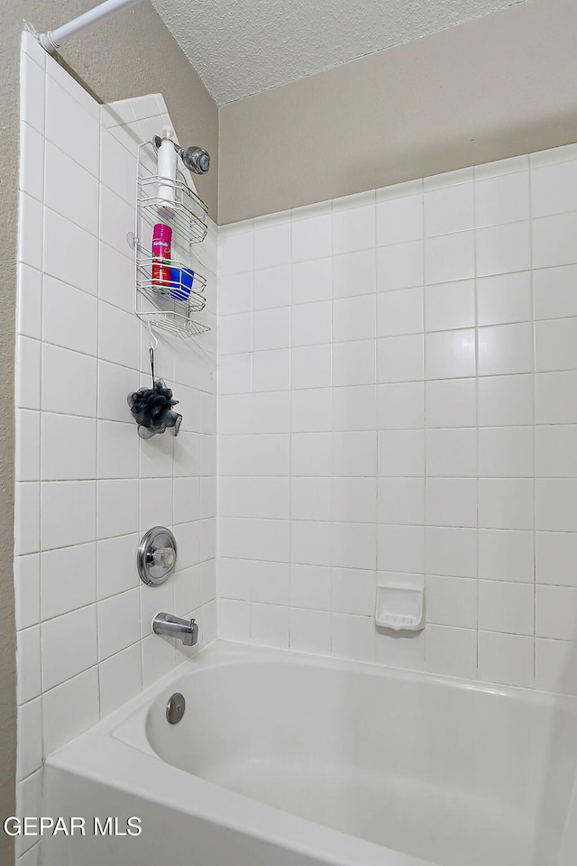 11840 Balladeer Ave, El Paso, TX 79936 - full bath featuring a textured ceiling and shower / bathtub combination