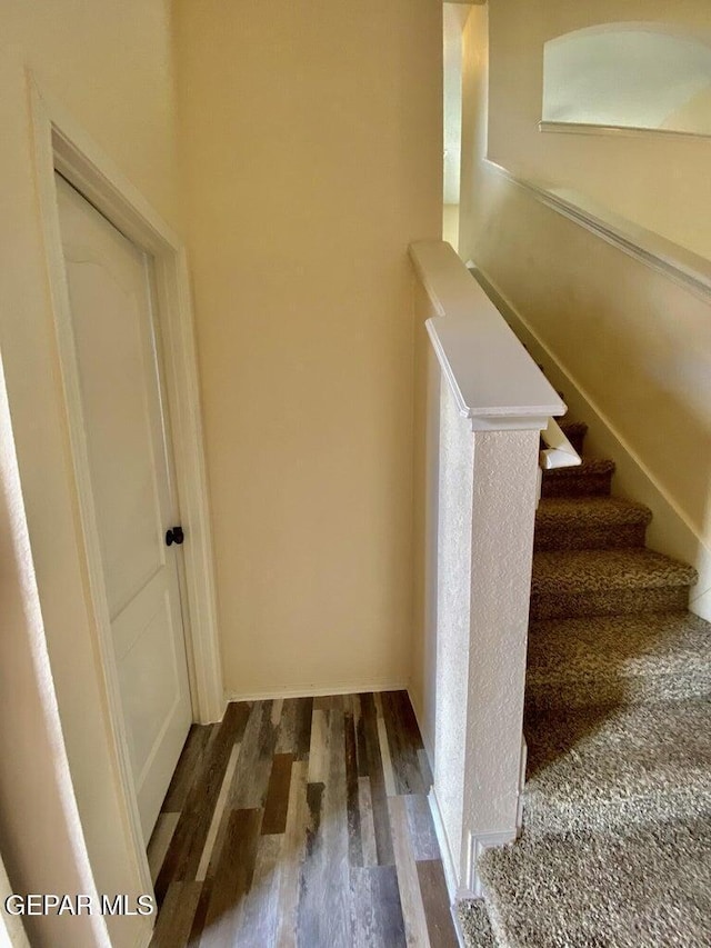6941 Jericho Tree Dr, El Paso, TX 79934 - staircase featuring wood finished floors