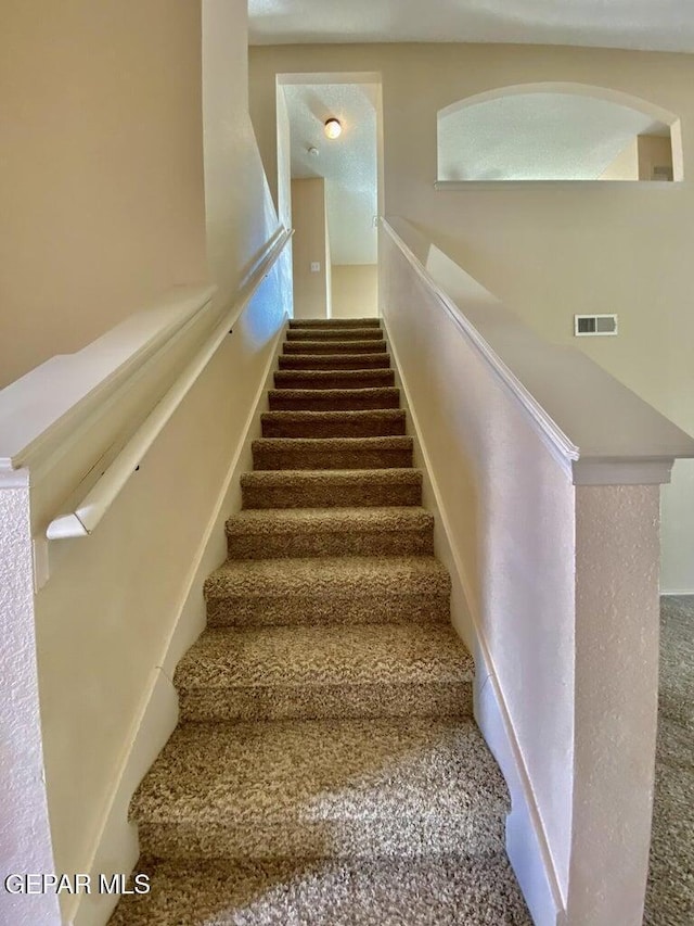 6941 Jericho Tree Dr, El Paso, TX 79934 - stairway featuring carpet