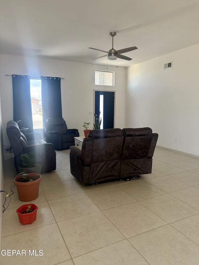 13862 Paseo Bosque Ave, El Paso, TX 79928 - living room with ceiling fan, light tile patterned flooring, and healthy amount of natural light