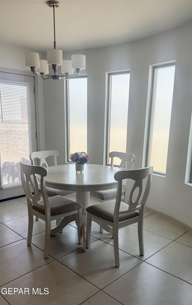 13862 Paseo Bosque Ave, El Paso, TX 79928 - dining room featuring a chandelier and light tile patterned flooring