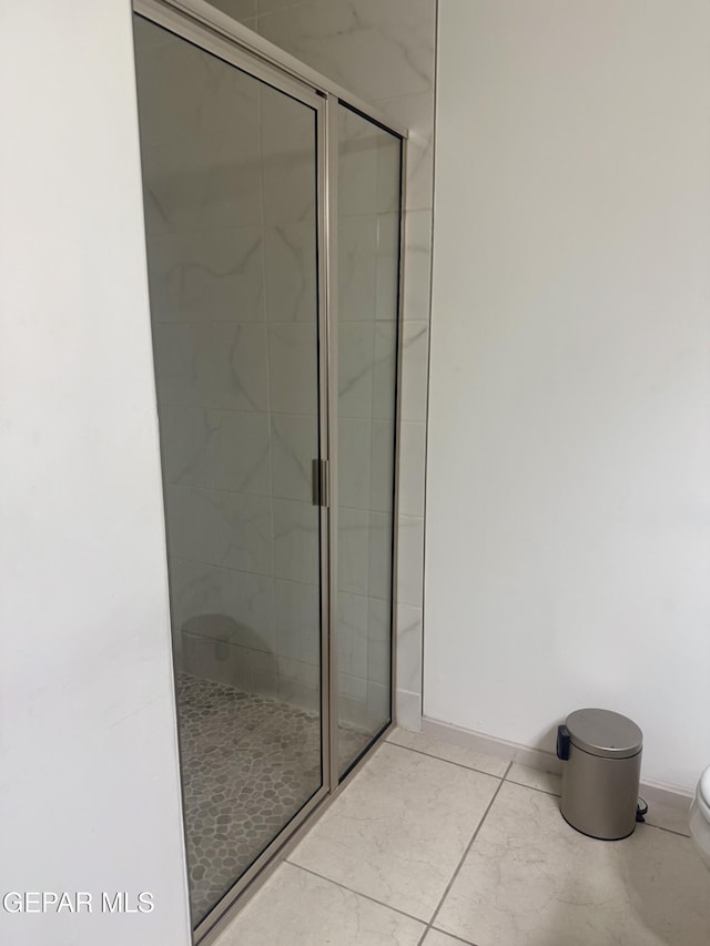 13862 Paseo Bosque Ave, El Paso, TX 79928 - full bathroom with toilet, a shower stall, baseboards, and tile patterned floors