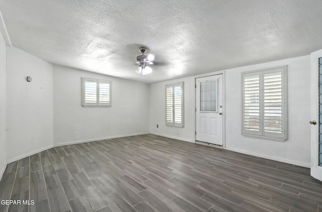 264 Edith Dr, El Paso, TX 79915 - empty room featuring a ceiling fan, dark wood-style floors, and a textured ceiling