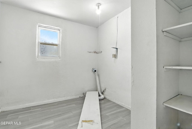 264 Edith Dr, El Paso, TX 79915 - laundry room with light wood-style flooring and baseboards