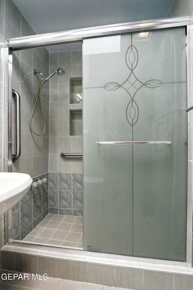 264 Edith Dr, El Paso, TX 79915 - bathroom featuring a stall shower