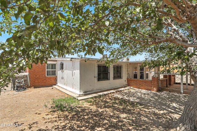 264 Edith Dr, El Paso, TX 79915 - rear view of house with brick siding and a patio area