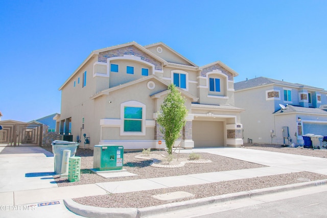 14737 Tierra Escape Ave, El Paso, TX 79938 - view of front facade with an attached garage, driveway, and stucco siding