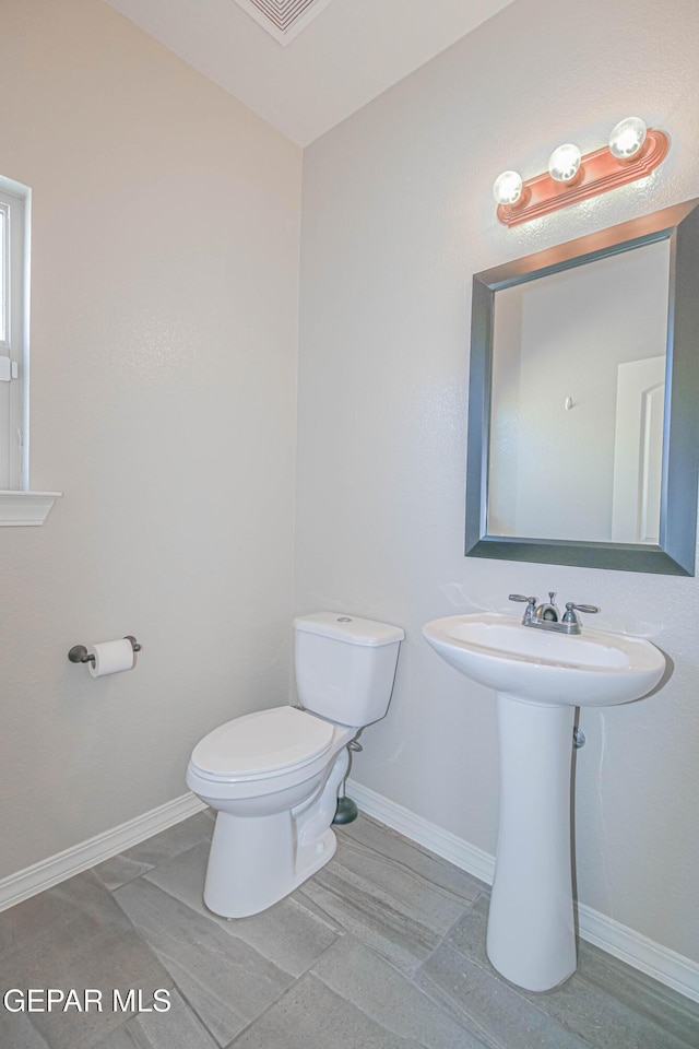 14737 Tierra Escape Ave, El Paso, TX 79938 - bathroom featuring toilet and baseboards