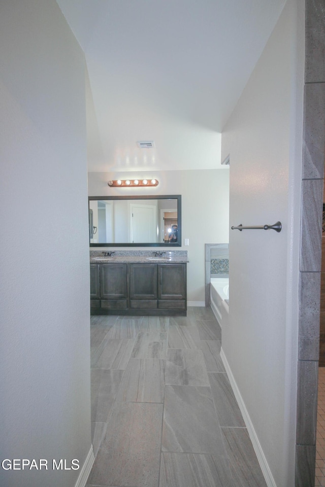 14737 Tierra Escape Ave, El Paso, TX 79938 - full bathroom featuring a bath and double vanity