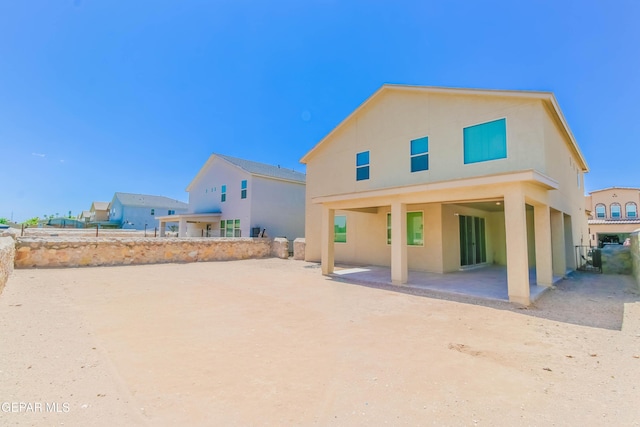 14737 Tierra Escape Ave, El Paso, TX 79938 - rear view of house with stucco siding and a patio area