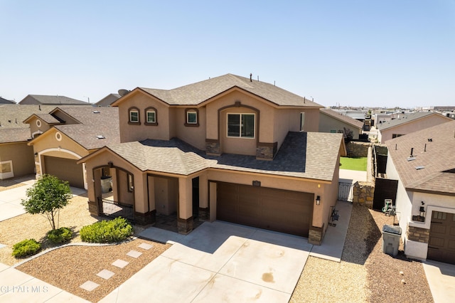 12320 Desert Path Ct, El Paso, TX 79938 - view of front facade with driveway, stucco siding, a gate, and an attached garage